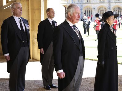 From left, Prince Andrew, Prince Edward, Prince Charles and Princess Anne arrive after walking in a procession behind the coffin of Prince Philip, with other members of the Royal family during the funeral of Britain's Prince Philip inside Windsor Castle in Windsor, England, Saturday, April 17, 2021. Prince Philip died April 9 at the age of 99 after 73 years of marriage to Britain's Queen Elizabeth II.