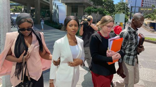 Haja Timbo leaves Brisbane Magistrates Court after being sentenced to 80 hours community service. 