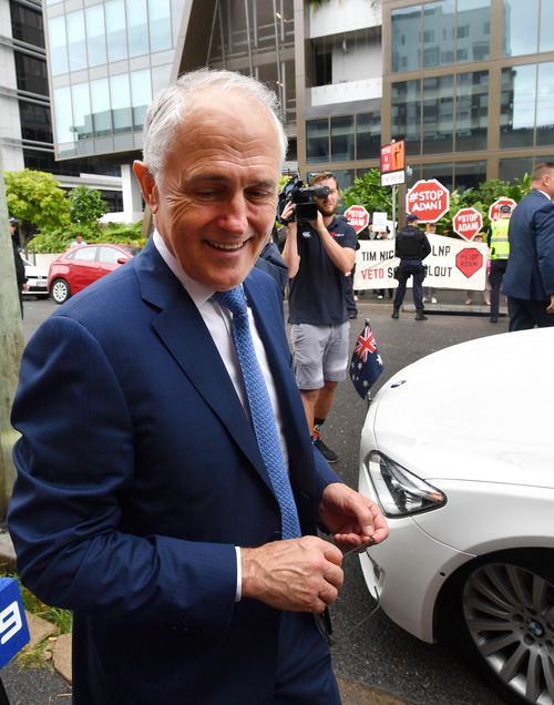 Malcolm Turnbull walks to his car at the LNP campaign launch in Brisbane today. (AAP)