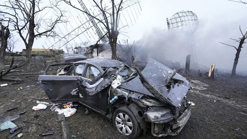 Damaged radar, a vehicle and equipment are seen at a Ukrainian military facility outside Mariupol, Ukraine.