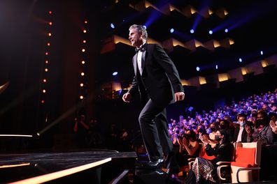 Eric Bana walks onto the stage during the 2021 AACTA Awards