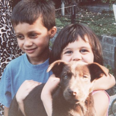 A young Turia Pitt with her brother and pup