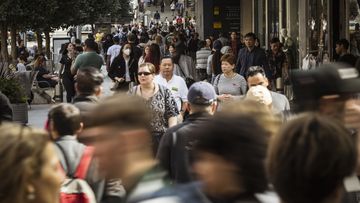 Busy pedestrian foot traffic at Bourke Street Mall, Melbourne.