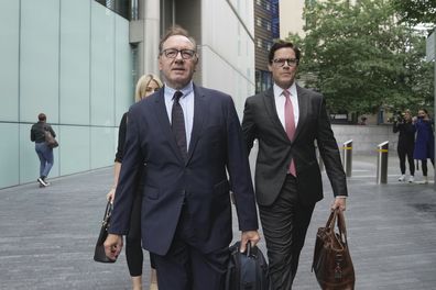 Actor Kevin Spacey, left, arrives at Southwark Crown Court in London, Britain, Friday, July 14, 2023. 