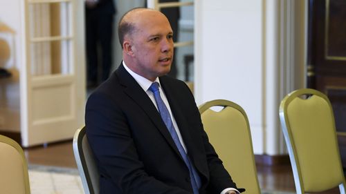 Liberal MP Peter Dutton is sworn in as Home Affairs Minister by Australian Governor-General Sir Peter Cosgrove during a ceremony at Government House in Canberra.