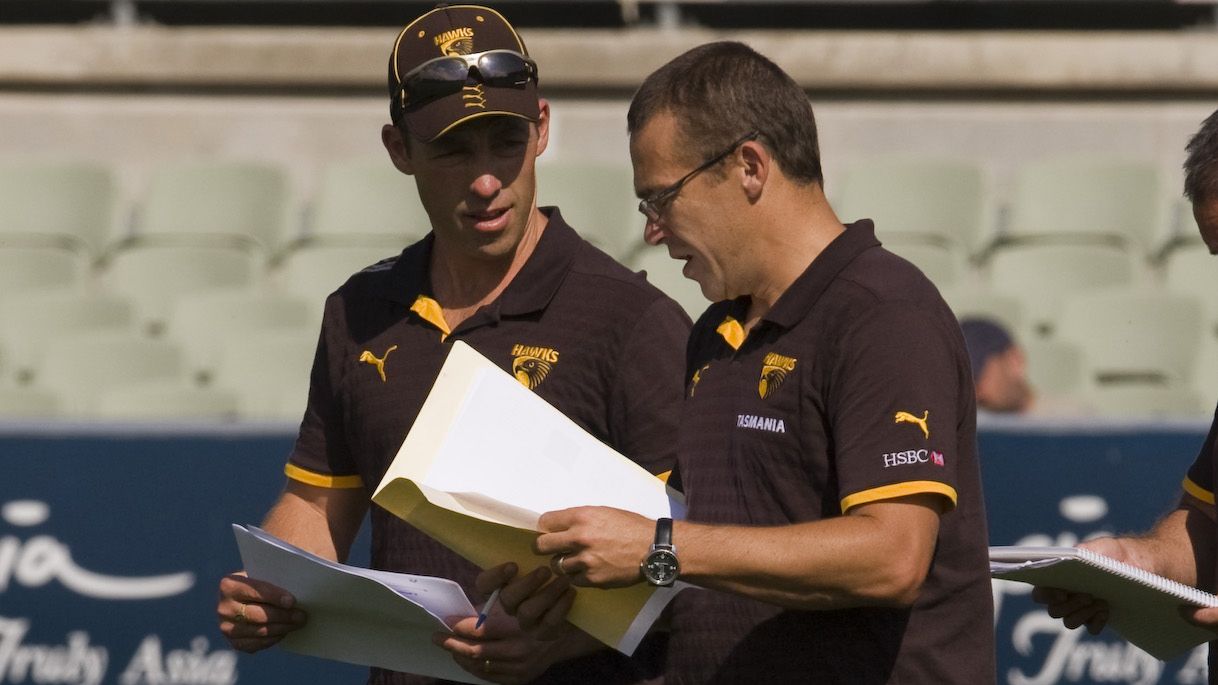 Hawthorn assistant coach David Rath compares notes with Alistair Clarkson in 2009.