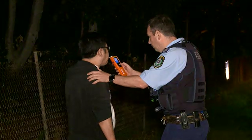 A 50-year-old man returned a positive blood alcohol reading after allegedly crashing into two parked cars in Sydney's west overnight.