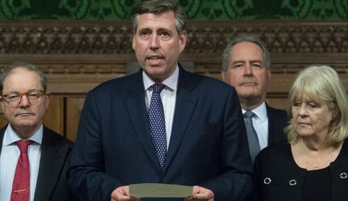 Sir Graham Brady (holding paper), chairman of the 1922 Committee, and flanked by Charles Walker (left), Geoffrey Clifton-Brown (second left), Bob Blackman, Cheryl Gillian and Nigel Evans (right), announces that Theresa May has survived an attempt by Tory MPs to oust her as party leader