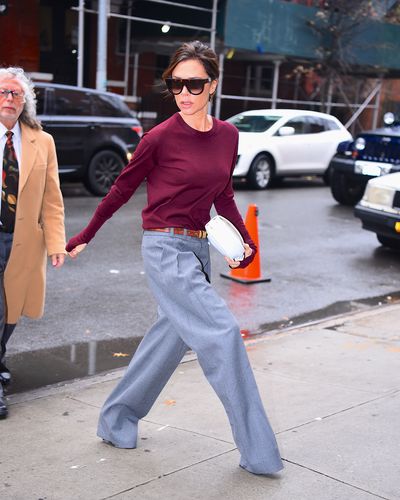 Victoria Beckham is the queen of working-mother  chic. We heart her oversized man pants, long-sleeved top with thumbhole detail and big sunnies as she heads off to the office.
