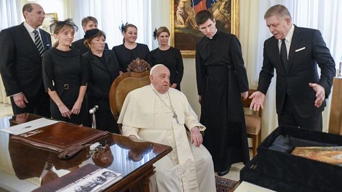 Pope Francis meets with Czech Republic's Prime Minister Robert Fico, right, and his entourage at The Vatican Friday, Feb. 14, 2025. (Vatican Media via AP, HO)