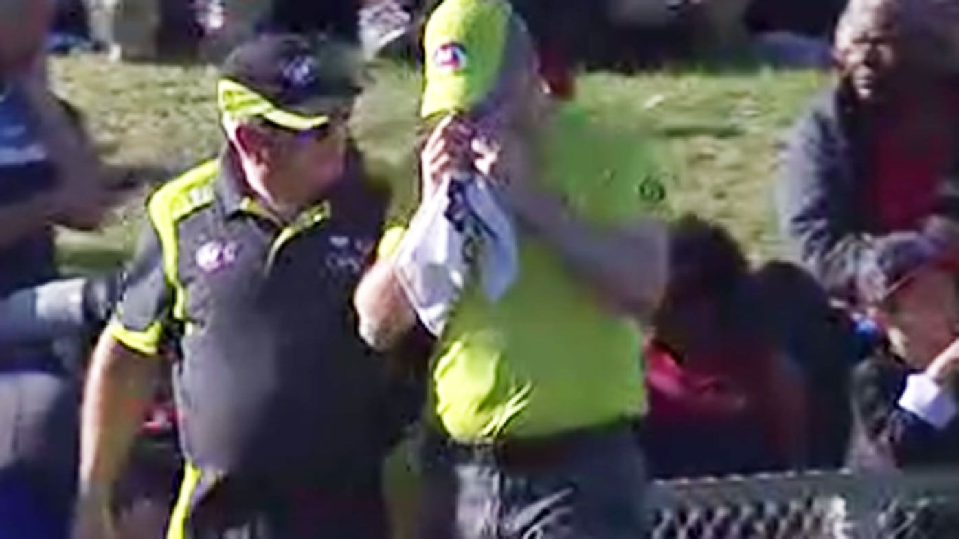 AFL goal umpire cops ball to the face