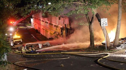 Firefighters attempting to put out the blaze. (Twitter/@joshfarley)