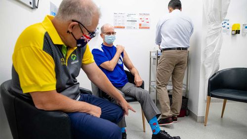 Scott Morrison and Dr Paul Kelly getting their second Pfizer vaccine at a GP clinic in Castle Hill, Sydney.