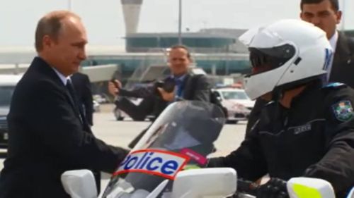 The Russian President thanked motorcycle police officers. (9NEWS)