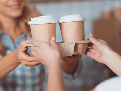 Woman buying takeaway coffee