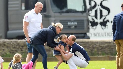 The Tindall's daughter Mia hugs Prince William. Picture: Getty