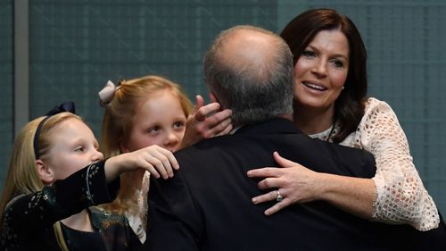 Scott Morrison embraces his family after delivering his 2017 Budget.
