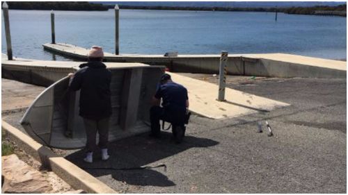 Police divers pulled a machete from the water. (9NEWS)