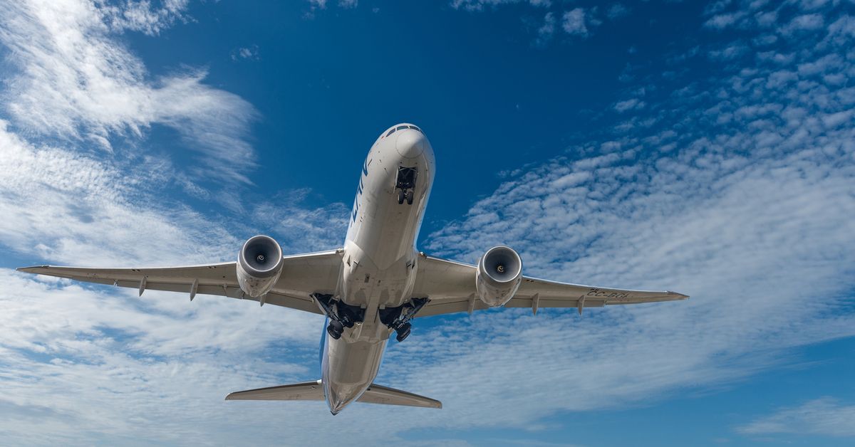 Man charged after allegedly attempting to open emergency exit door mid-flight