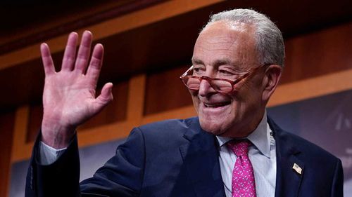 Senate Majority Leader Chuck Schumer says good night after speaking to reporters following a hectic series of amendment votes and final passage on the big debt ceiling and budget cuts package.