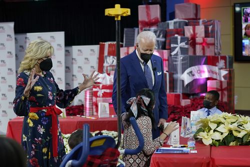 President Joe Biden and first lady Jill Biden visit the patients at Children's National Hospital in Washington, Friday, Dec. 24, 2021. 