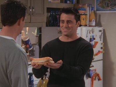 A screenshot of Friends character Joey sharing a sandwich.