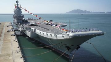 Taiwan&#x27;s defence ministry said Saturday that it detected three ships from the Chinese navy, one of which was the Shandong aircraft carrier (pictured), passing through the Taiwan Strait. 