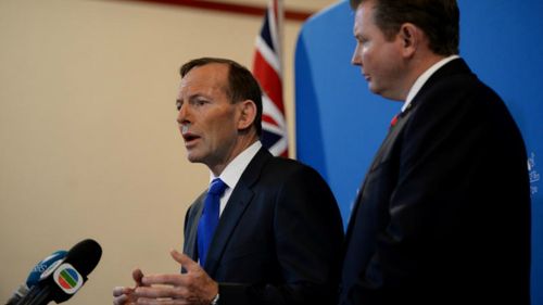 Prime Minister Tony Abbott speaks with members of Australia's multicultural media during a question and answer session, at Strathfield Town Hall, in Sydney. Picture: AAP