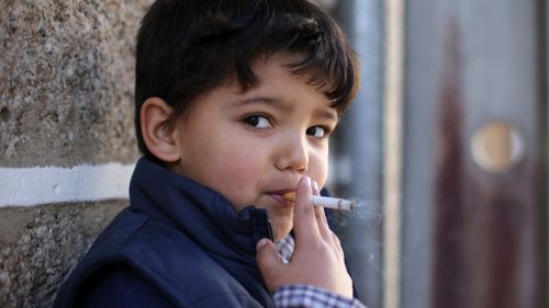 Children as young as five are being encouraged to smoke cigarettes in the Portuguese village of Vale de Salgueiro. (AAP)
