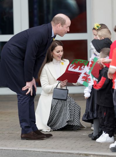 Prince William, Prince of Wales and Catherine, Princess of Wales speak with young well-wishers as they depart Aberavon Leisure & Fitness Centre during their visit to Wales on February 28, 2023 in Port Talbot, Wales.