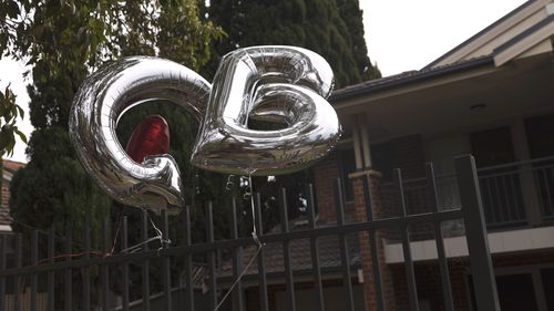 Balloons are tied to the front gate of Gladys Berejiklian's Sydney home today after her shock resignation.