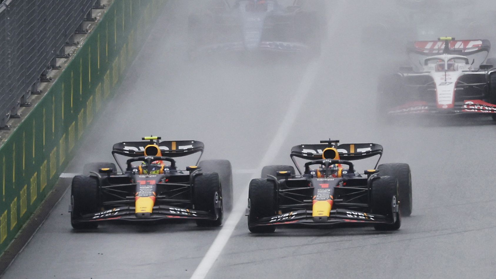 Max Verstappen (right) pushed Sergio Perez across towards the pit wall at the start of the sprint at the Austrian Grand Prix.