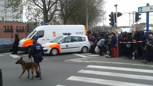 The media gather at Molenbeek. (Twitter/@buddendorf)