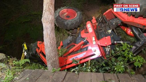 A Sunshine Coast man nearly had his legs crushed after his tractor rolled over while he was slashing grass last night (Supplied).