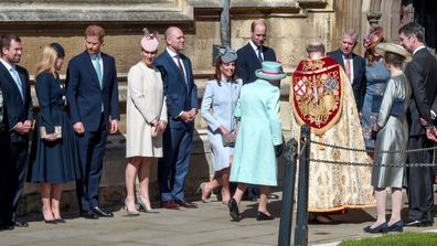 Members of Britain's Royal family watch as Britain's Queen Elizabeth II arrives to attend the Easter Mattins Service at St. George's Chapel, at Windsor Castle in England Sunday, April 21, 2019