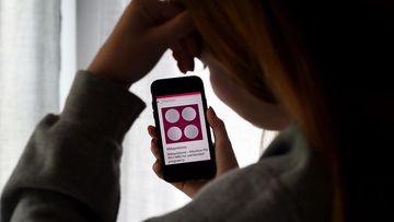 In this photo illustration, a person looks at an Abortion Pill (RU-486) for unintended pregnancy from Mifepristone displayed on a smartphone on May 8, 2020, in Arlington, Virginia. - One week after Sally realized she was pregnant, her home state Texas temporarily banned abortions, deeming them unnecessary elective procedures that were suspended because of the coronavirus crisis.So, the 34-year-old, whose name has been changed for this story to protect her privacy, took matters into her own hands