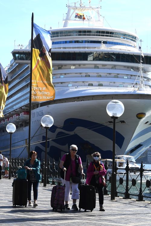 Cruise ship passengers disembark from the Ruby Princess at Circular Quay in Sydney, on March 19.