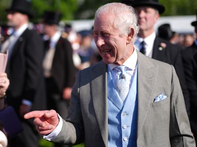 King Charles III speaks to guests attending a Royal Garden Party at Buckingham Palace on May 8, 2024 in London, England.  (Photo by Jordan Pettitt - Pool/Getty Images)