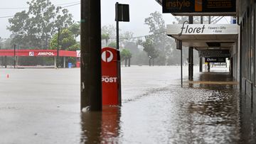 Shops are inundated by floodwater in the central business district in Lismore, in NSW.  