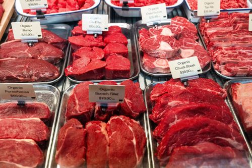 Cuts of beef in a butcher's window.