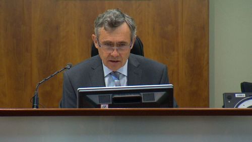 Magistrate Tony Parsons conducts hearings to determine whether one applicant will be jailed and one will be admitted.