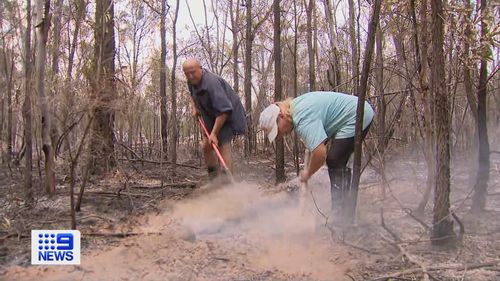 Inside the fire zone Corinne Pimm and Ward Sutton were showing 9News around their property when they spotted a fire flaring up.