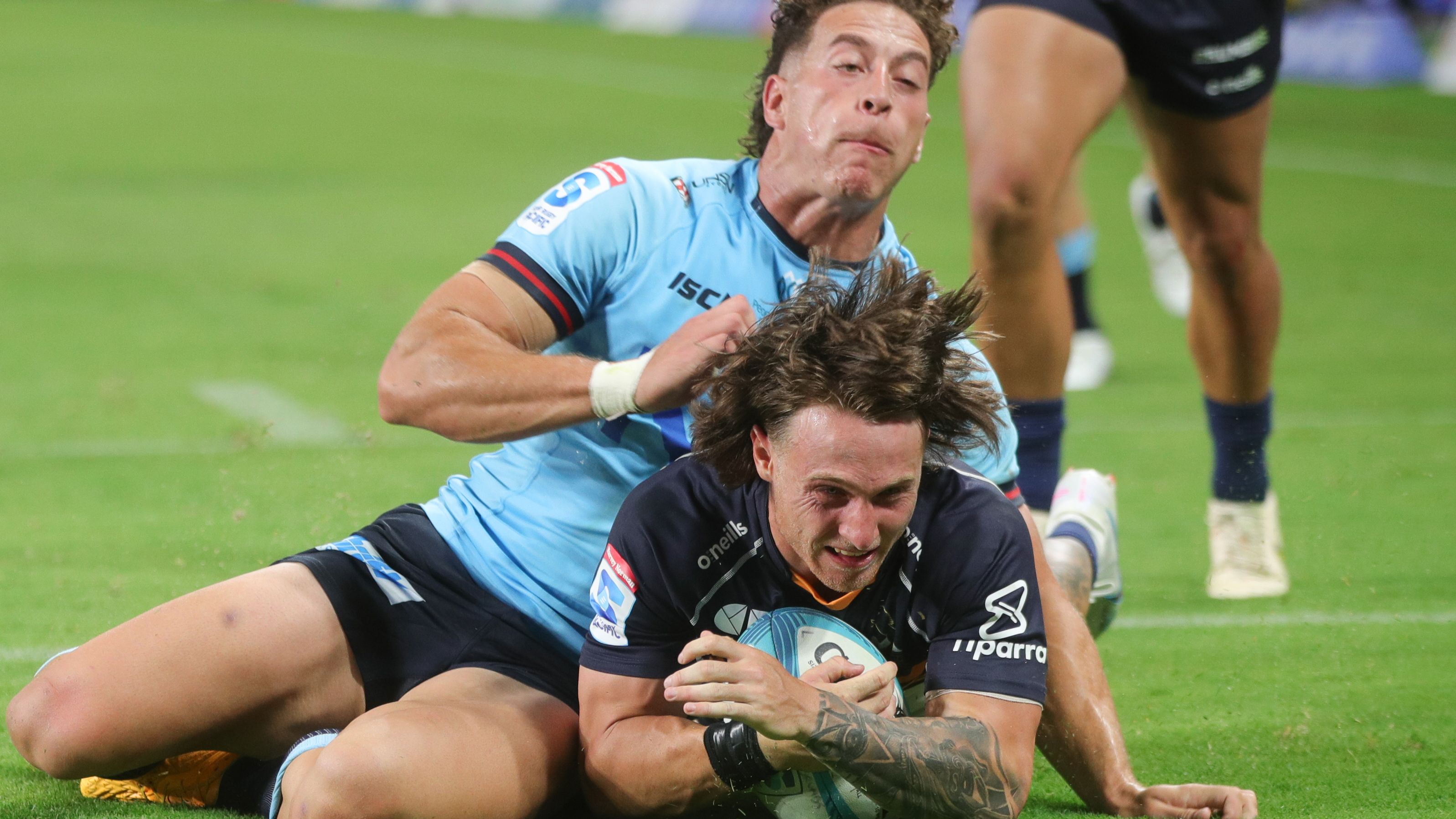 Corey Toole of the Brumbies scores a try.