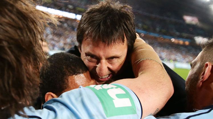 Laurie Daley celebrates the victory with his team.