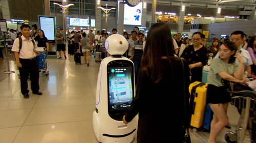 Robots are being used as guides around train stations.