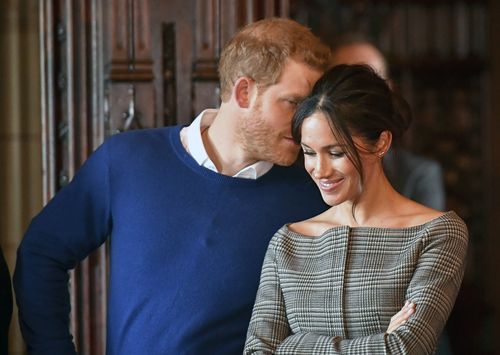 The pair share a quick moment during a performance in the castle. (AAP)