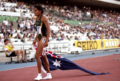 Cathy Freeman of Australia celebrates after winning the 400m event during the World Athletics Championships held at the Estadio Olimpico in Seville, Spain.