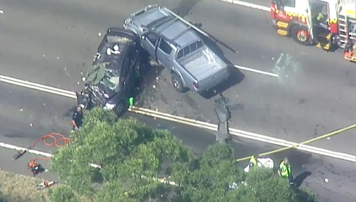 Three people were hospitalised and one needed to be cut from their vehicle after a serious crash that left a police officer critical in Lucas Heights this afternoon.