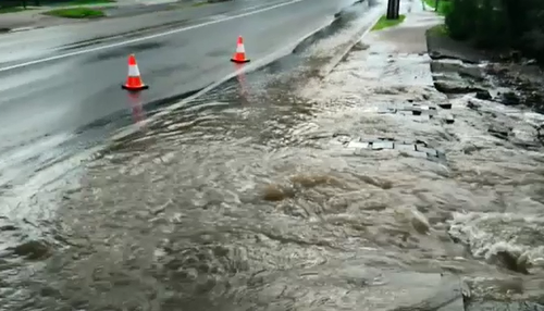 The pipe burst on Milne Road, Modbury North before 7am, flooding front yards as well as a garage and a shed. 