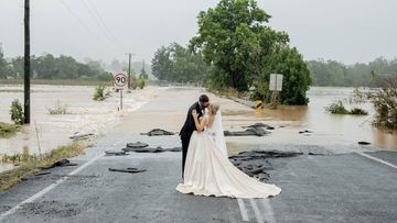 Kate Fotheringham shared this photo of her wedding on Twitter, after being rescued from floodwaters near Taree so she could make it down the aisle.